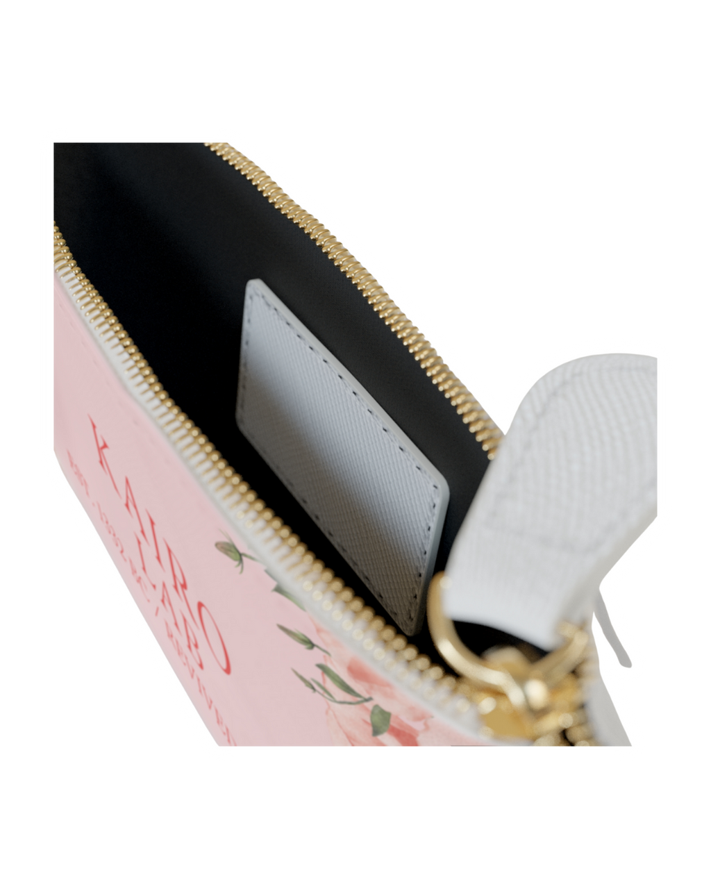 Detailaufnahme einer rosafarbenen Reißverschlusstasche mit Blumenmuster und goldfarbenem Verschluss